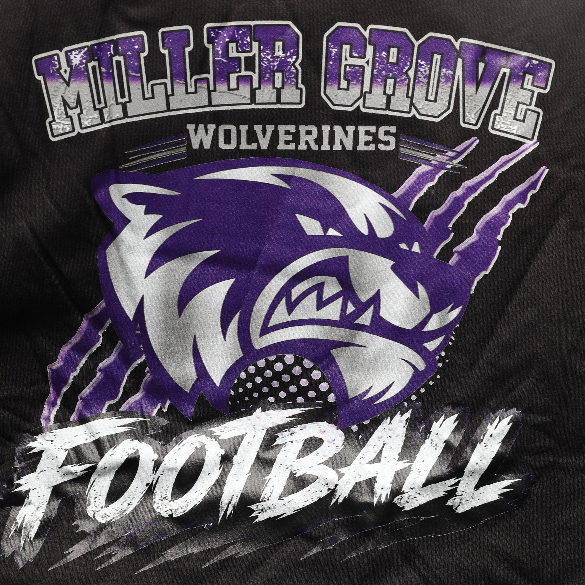 Miller Grove Wolverines Football tee in black with purple and silver mascot graphic