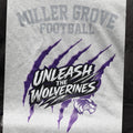 Miller Grove Unleash the Wolverines tee in heather grey with purple claw mark graphic