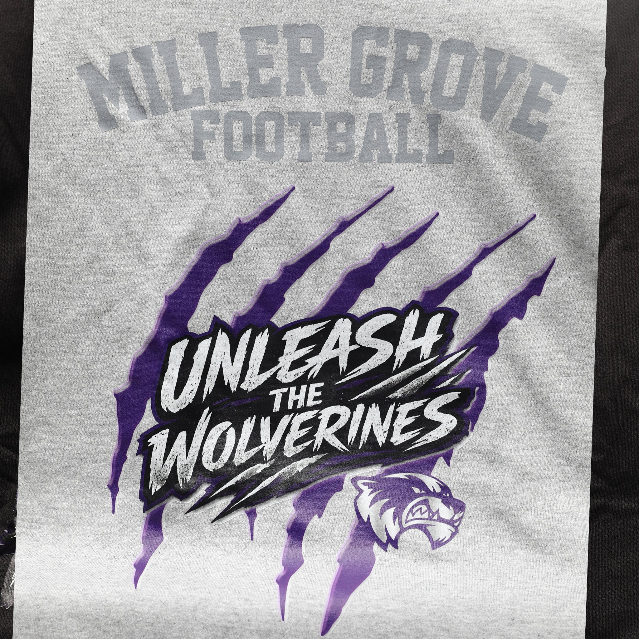 Miller Grove Unleash the Wolverines tee in heather grey with purple claw mark graphic