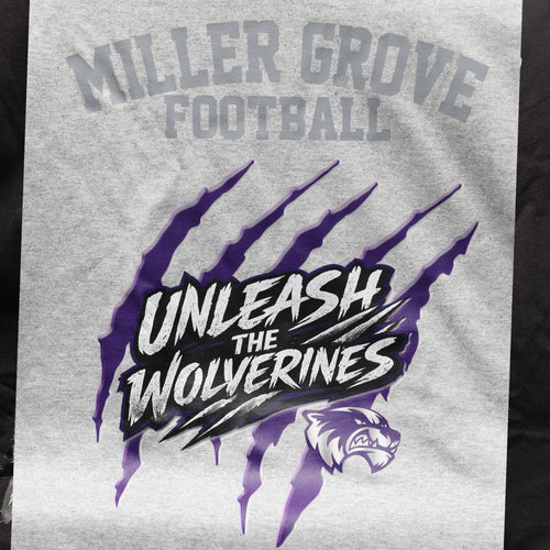 Miller Grove Unleash the Wolverines tee in heather grey with purple claw mark graphic